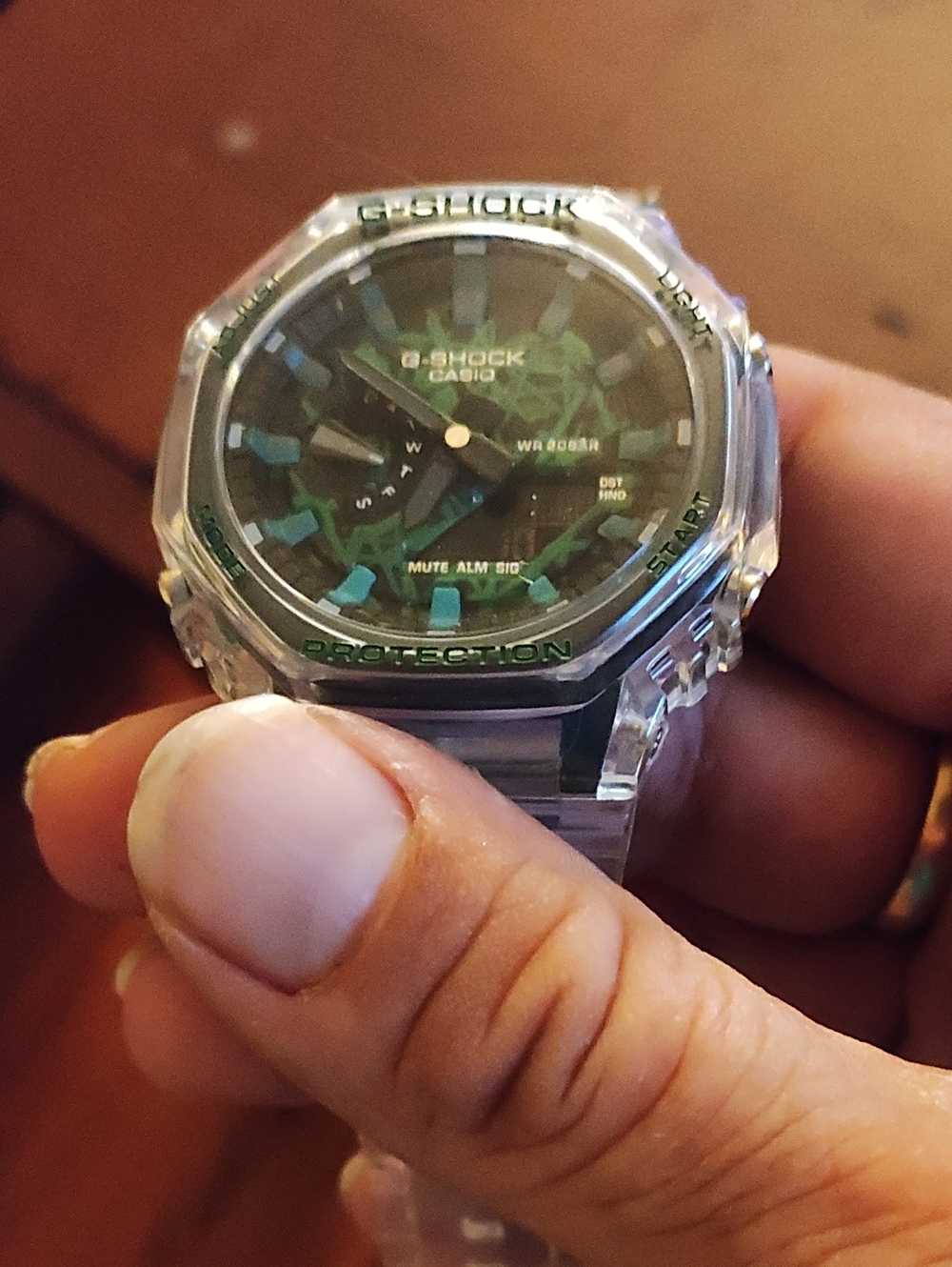G-Shock Transparent Case with Green and Teal Dial Accents
